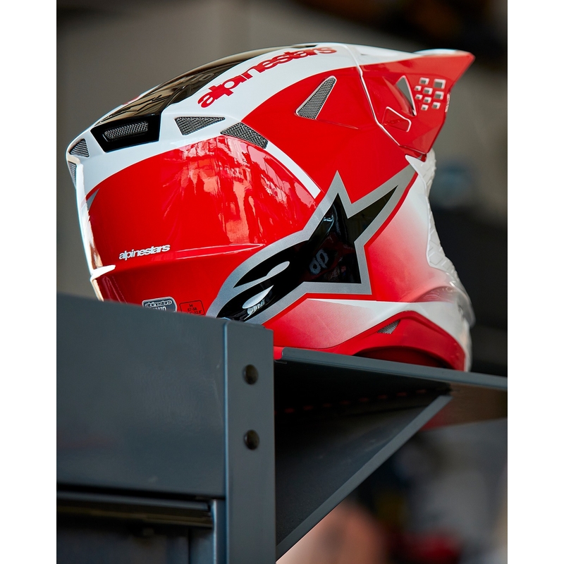 Alpinestars Supertech S-M10 Unite motokroso šalmas raudonos ir baltos spalvos