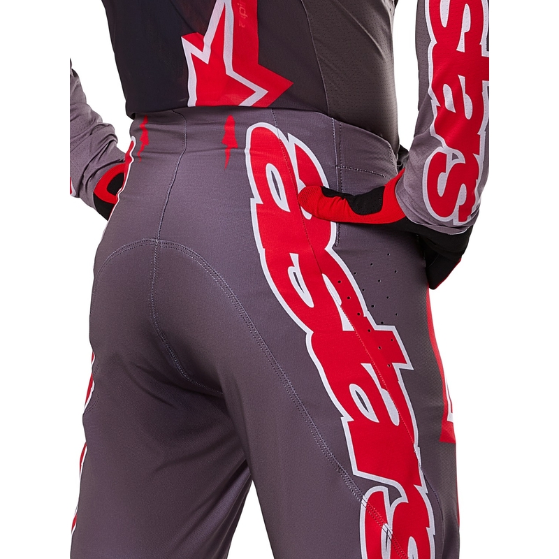 Alpinestars Supertech Lipan Smoke Red motokroso kelnės