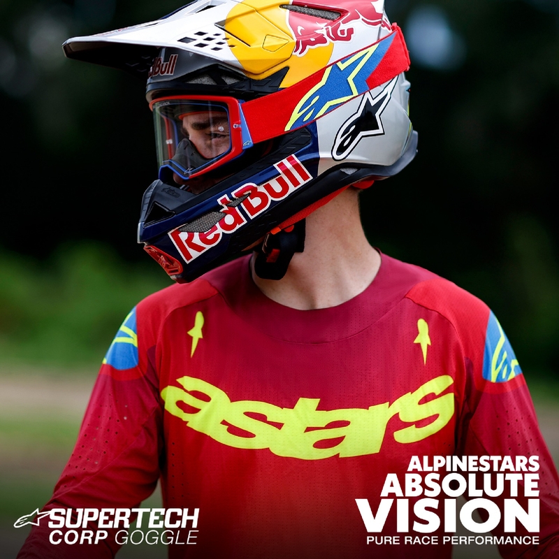 Alpinestars Supertech Corp baltos ir auksinės spalvos motokroso akiniai su veidrodiniais auksiniais lęšiais