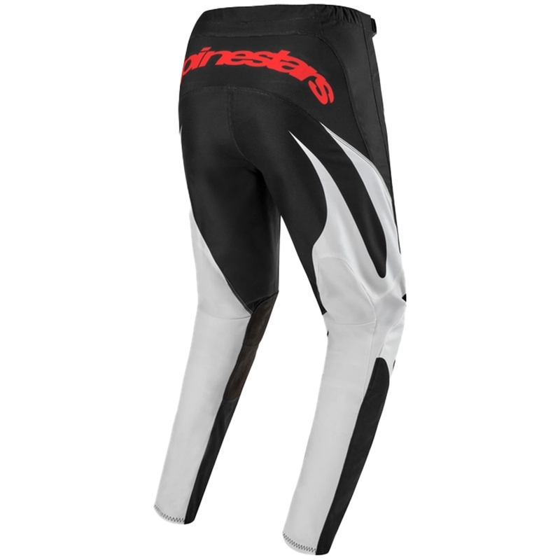 Alpinestars Fluid Lucent motokroso kelnės juodos, baltos ir raudonos spalvos