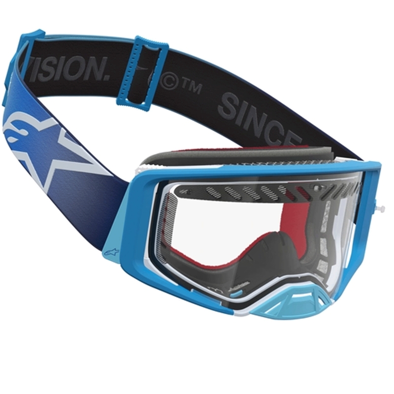 „Alpinestars Supertech Dura Air Fluid“ mėlynai sidabriniai motokroso akiniai su skaidriu plexiglasu