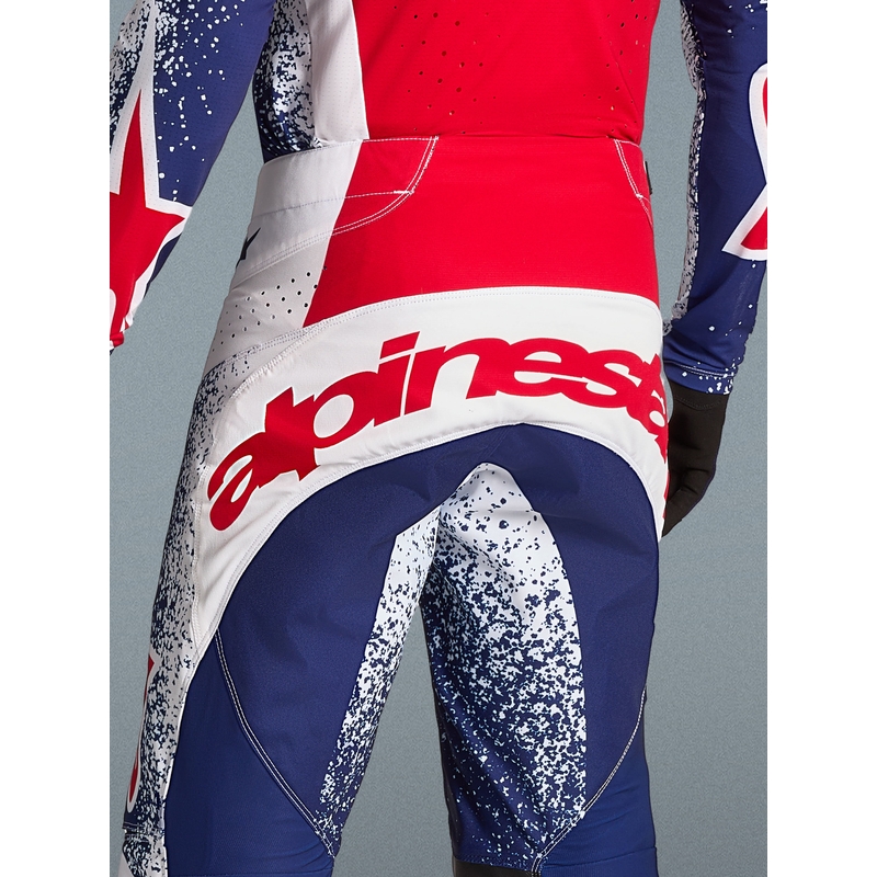 „Alpinestars Techstar Limited Edition Unity“ raudonos-baltos-mėlynos motokroso kelnės